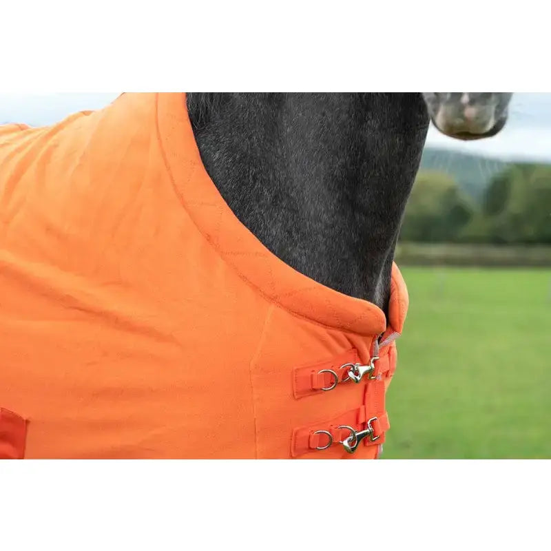 Bright orange fleece horse rug with quilted design and silver buckles perfect as a luxury fleece rug