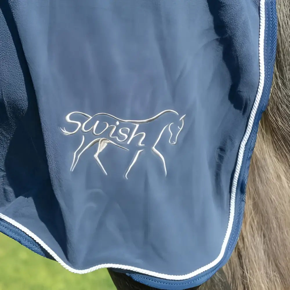 Navy plush swish fleece rug with fixed neck cover white embroidered logo and cross surcingles trim for horses