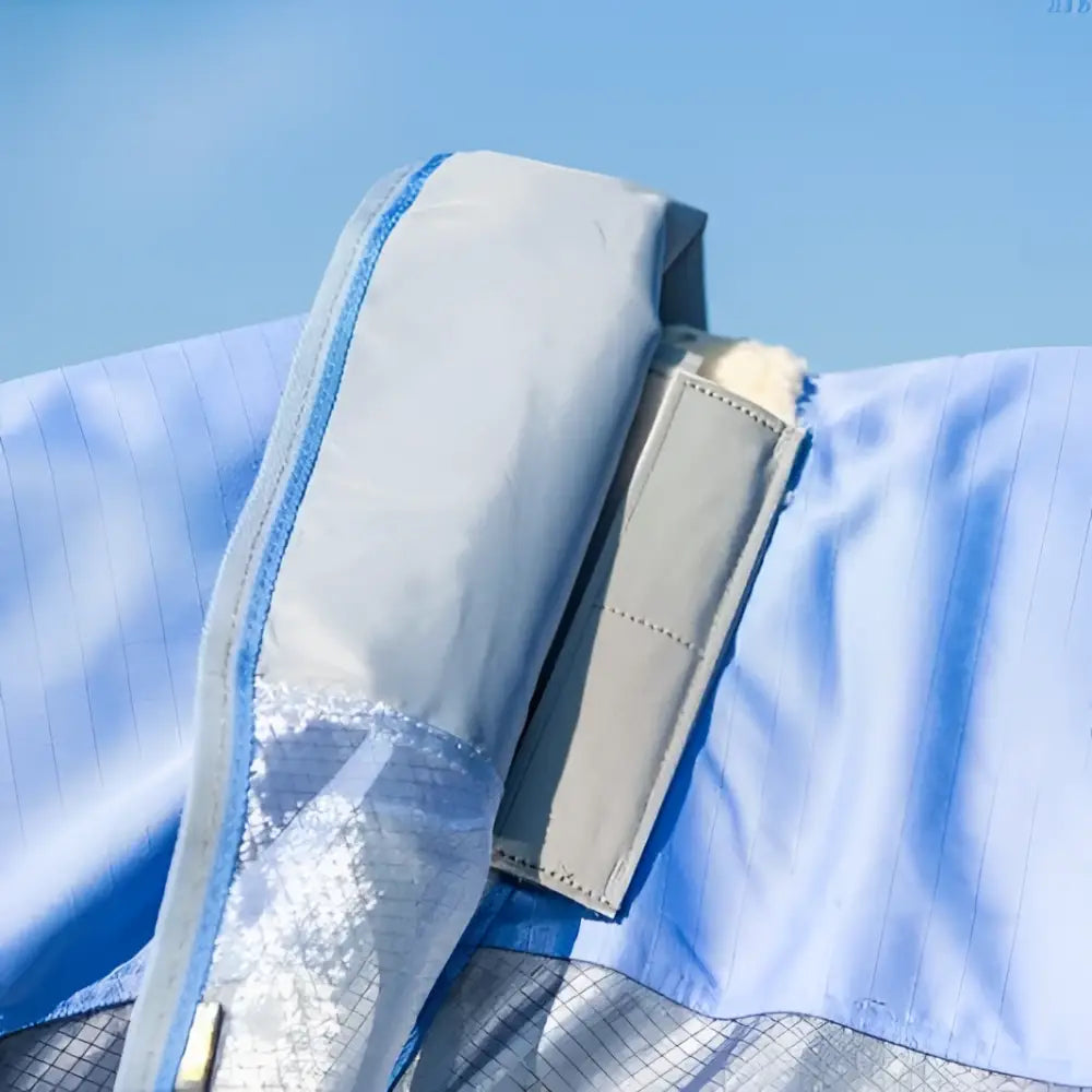 Light blue swish fly turnout combination rug with breathable nylon mesh lining and double locking gray zipper pull