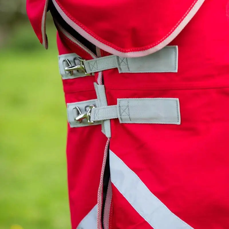 Red swish wide fit 50g detachable neck turnout rug with gray straps silver buckles reflective stripes and tail flap