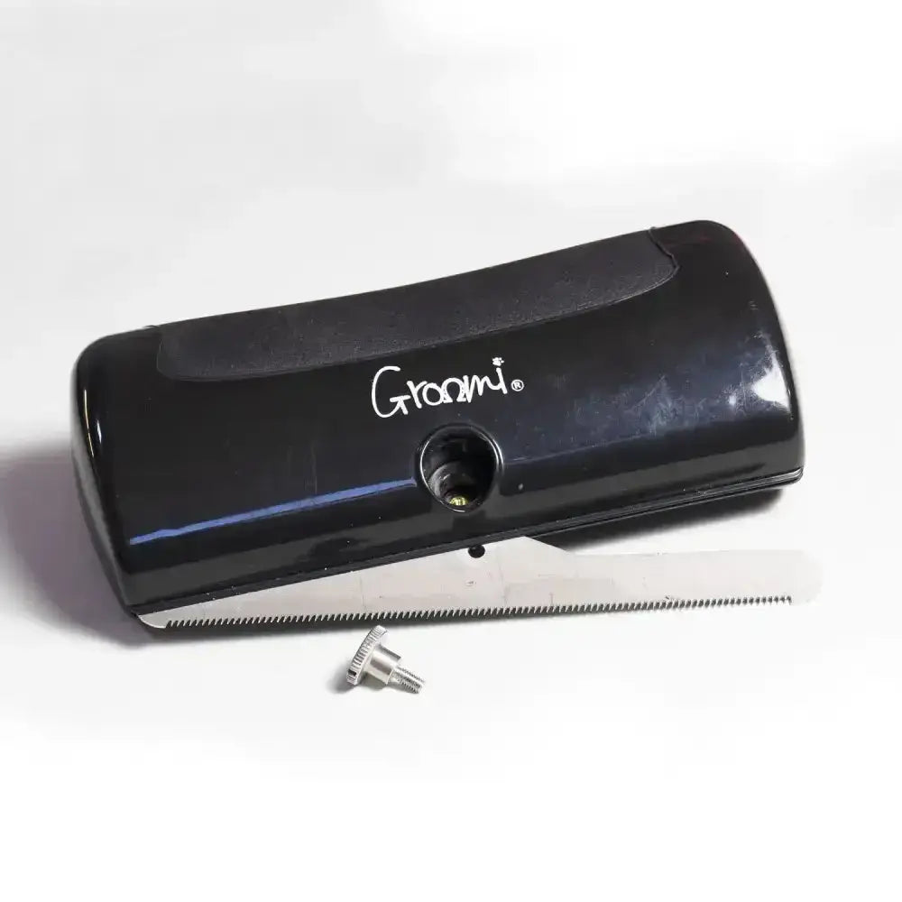 Black groomi shedding brush with sleek glossy finish and metal comb blade quick release horse shedding tool