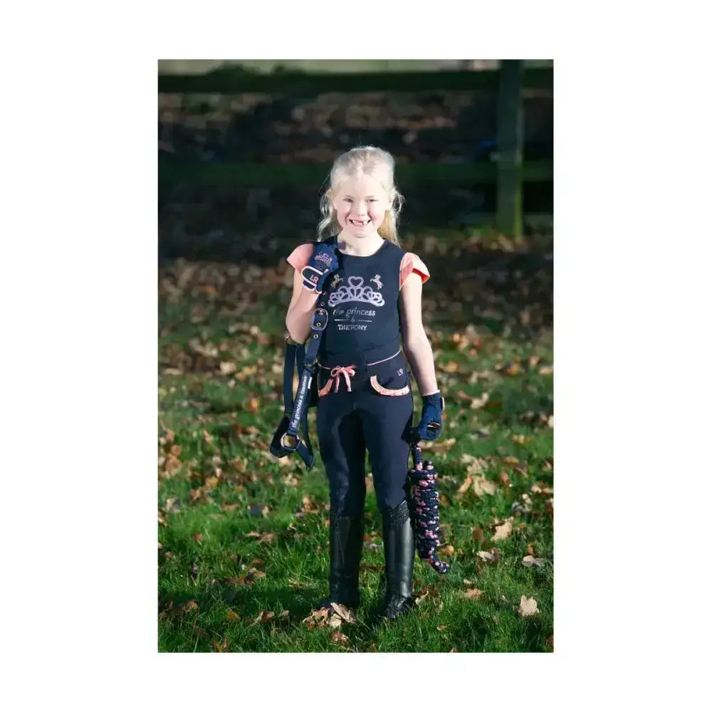 Black equestrian vest with pink trim and crown design worn over a pony loving princess navy t-shirt features pony t-shirt