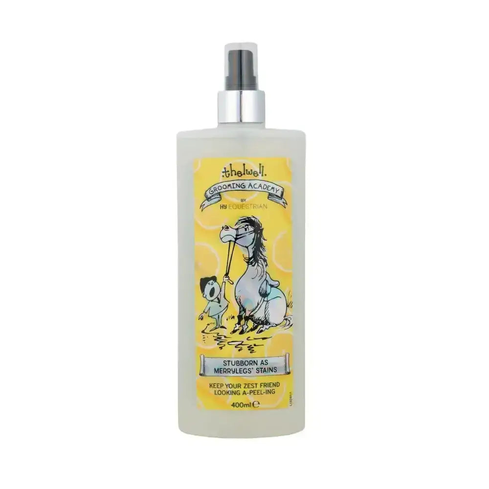 A translucent white spray bottle with silver nozzle and yellow label showing horse and child for merrylegs stains from thelwell grooming academy