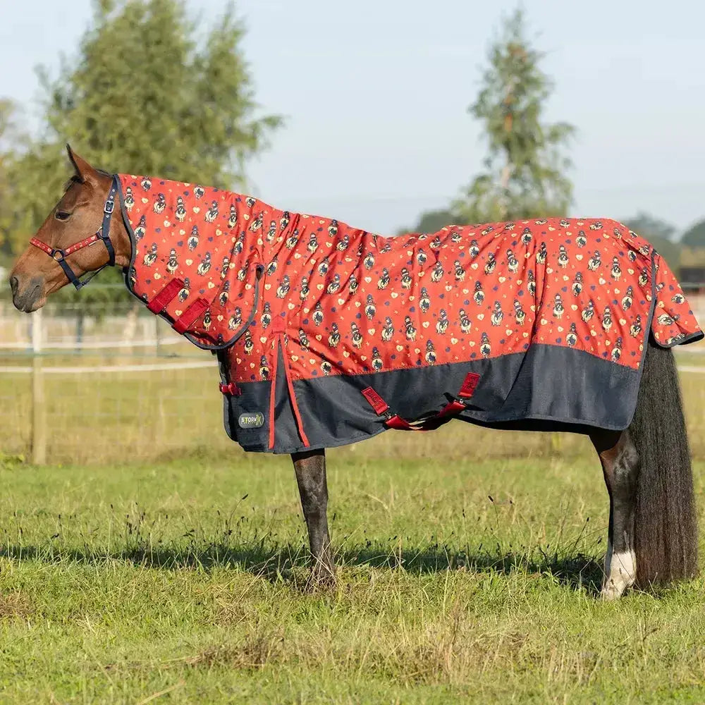 Red and navy thelwell rugs stormx original turnout rug with playful cartoon pattern and adjustable straps for a secure fit