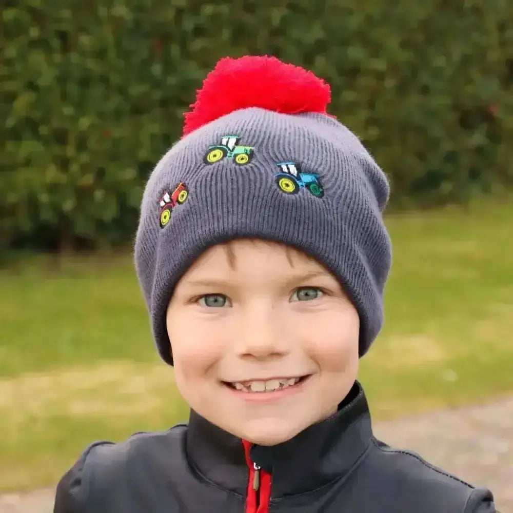 Gray knitted hat from the tractor collection hat by little knight with colorful tractor embroidery and red pom pom for kids