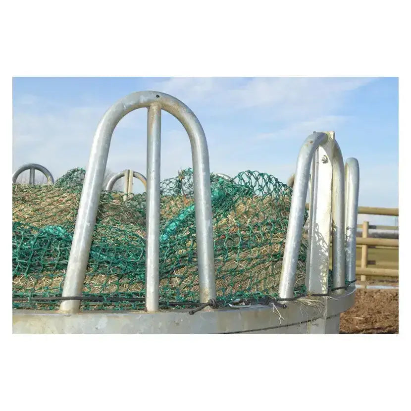 Silver metal trickle net topper with green mesh netting filled with hay for inside ring feeders unique design