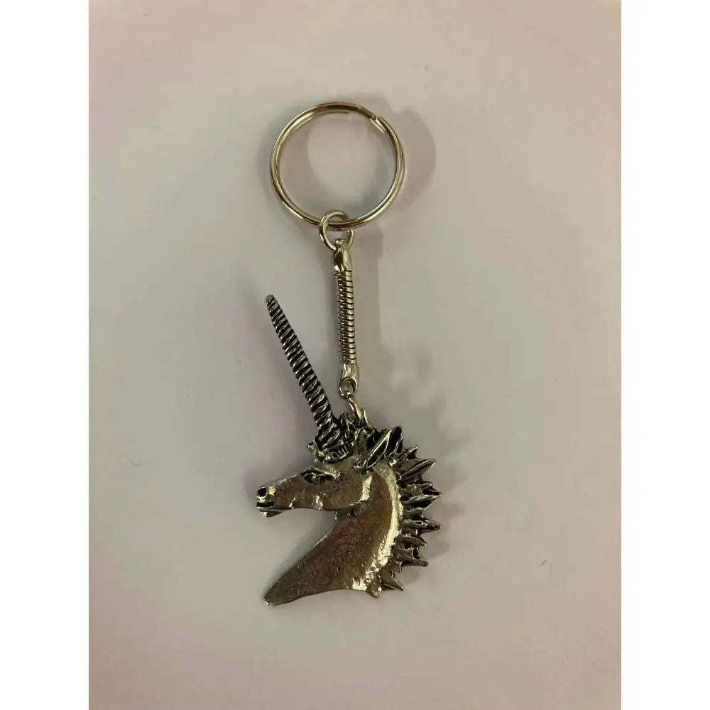 Silver unicorn key ring with detailed head and spiral horn perfect for apparel and accessories fans