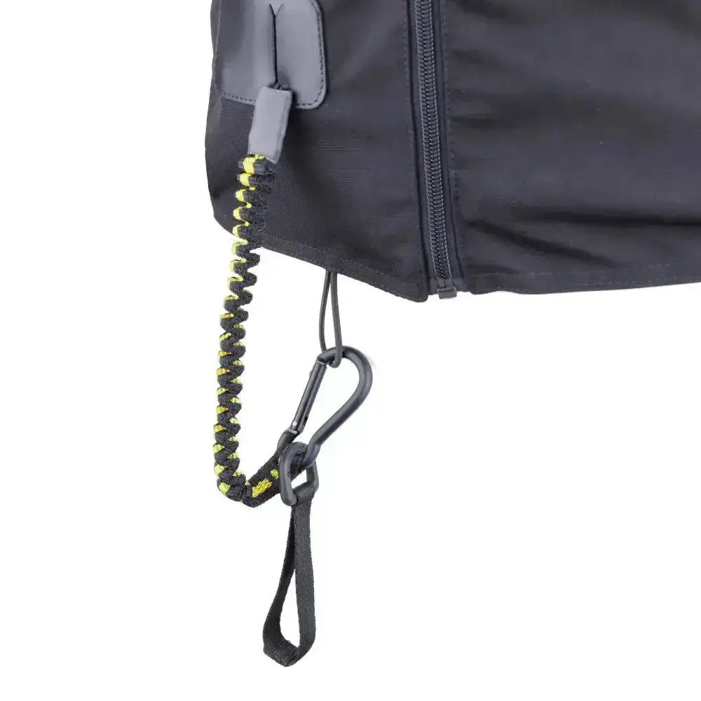 Black and neon yellow coiled strap with carabiner clip attached to dark gray usg equiairbag aixplorer air vest bag