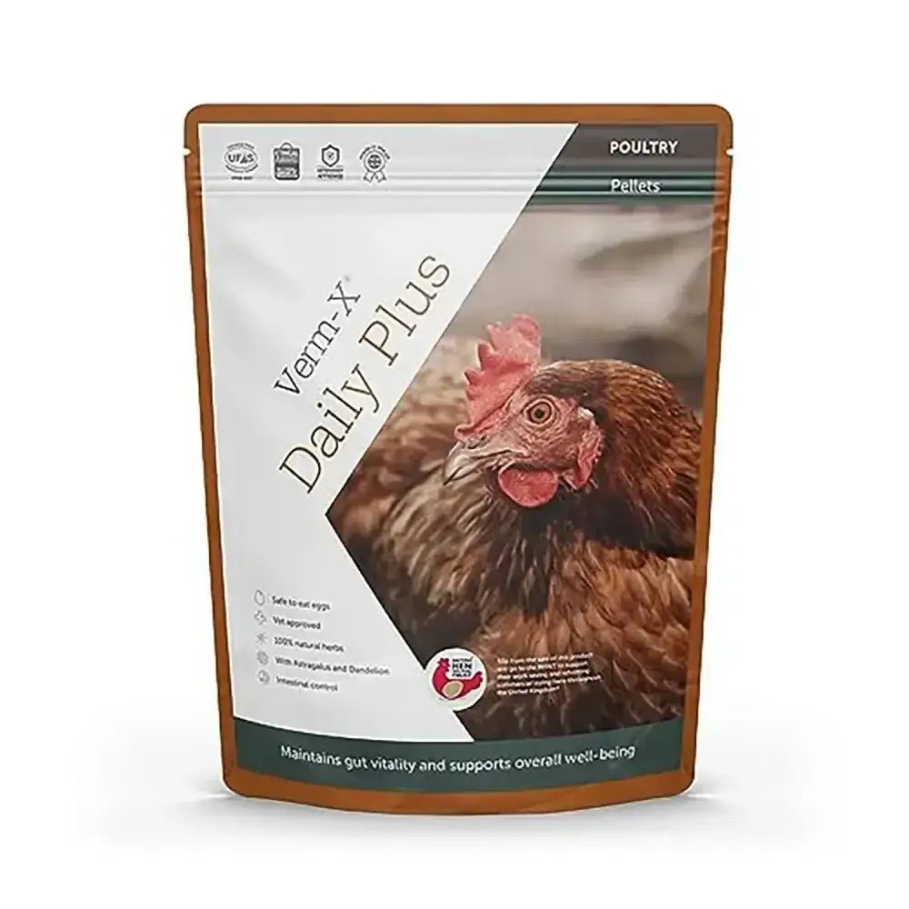 Brown chicken with red comb on white and brown pouch of verm-x daily plus natural feed additive for poultry ducks and fowl