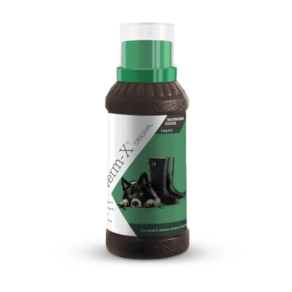 Brown plastic bottle with green cap labeled verm-x original liquid for dogs with natural active ingredients for intestinal hygiene