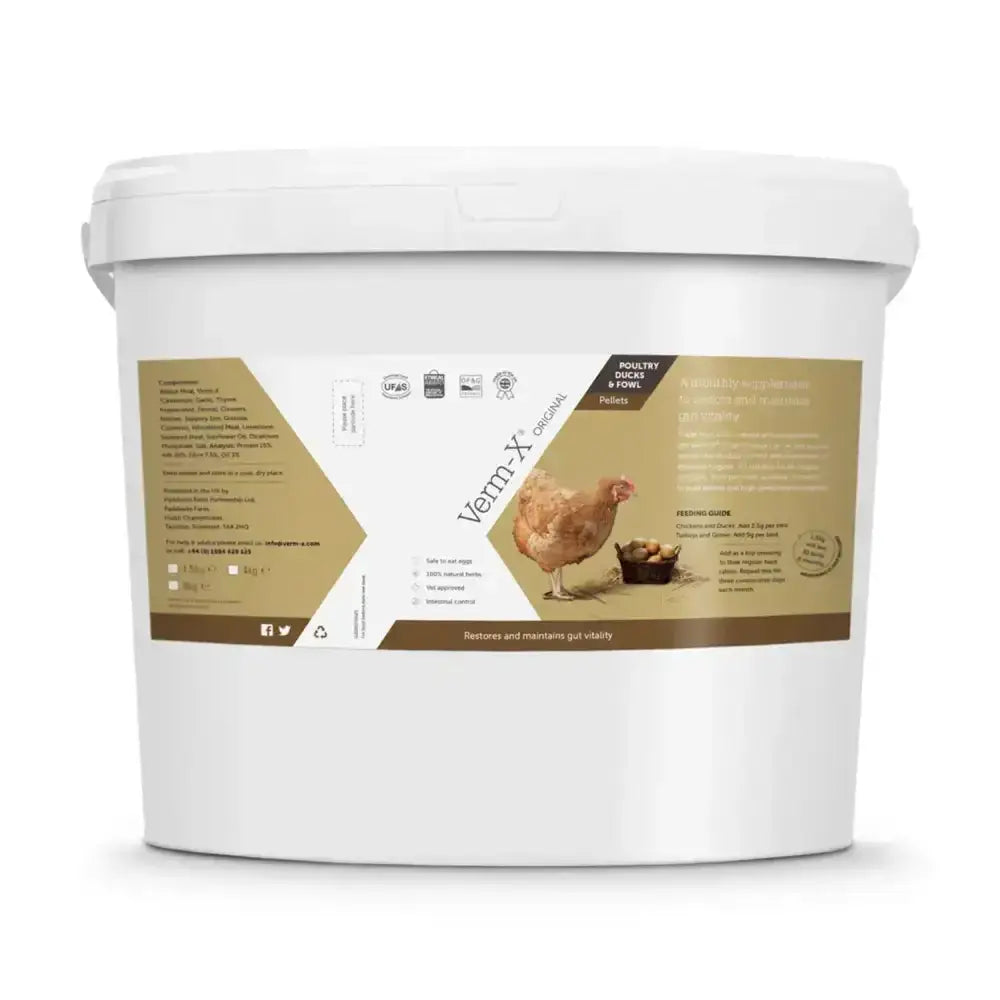 White plastic bucket of verm-x original pellets with natural active ingredients to control intestinal hygiene in poultry