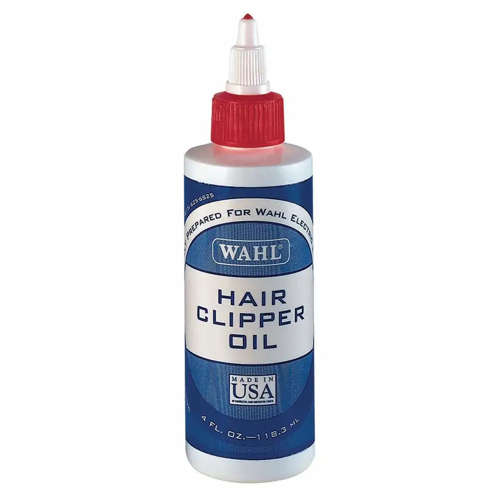 Wahl clipper oil in a white plastic bottle with red cap and blue label for smooth clipper performance 113 ml
