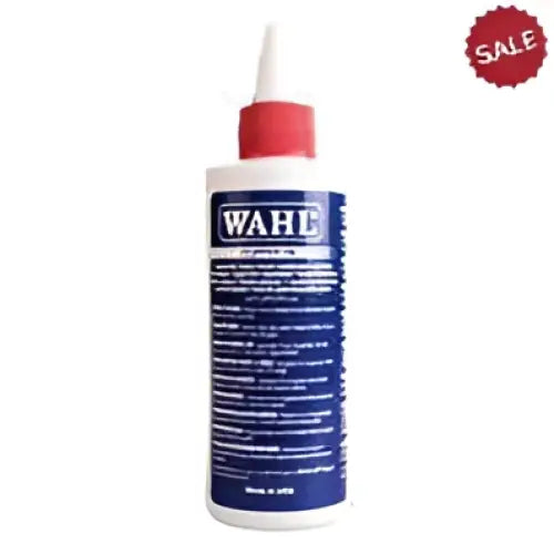 White plastic bottle with red cap and blue label of wahl clipper oil 113 ml for clipper maintenance