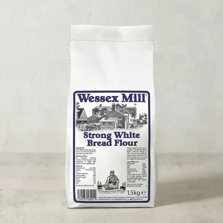 White paper bag of wessex mill strong white bread flour 1.5kg with blue black label and mill illustration