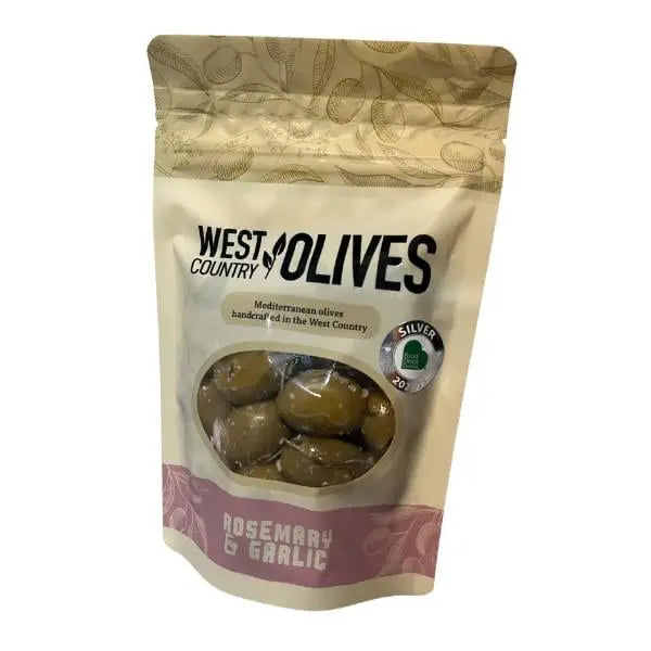 A beige and pink pouch of west country rosemary and garlic olives with green olives visible, perfect for delphi stuffed green fans