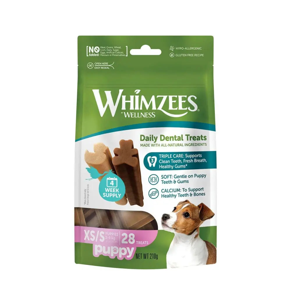 Green and white whimzees puppy daily dental treats package with brown bone shaped puppy treats for healthy teeth