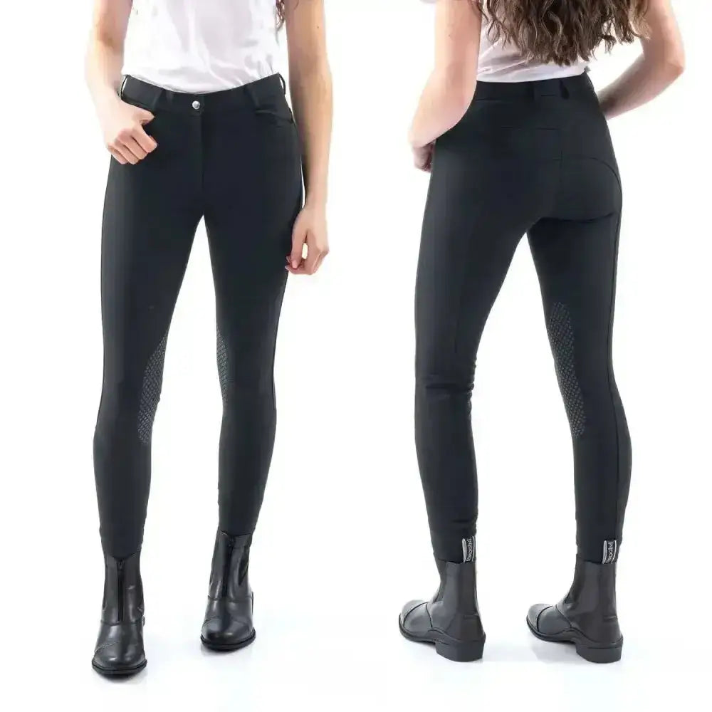 Black whitaker clayton grip knee breech with reinforced mesh panels on thighs and subtle logo on ankle cuffs