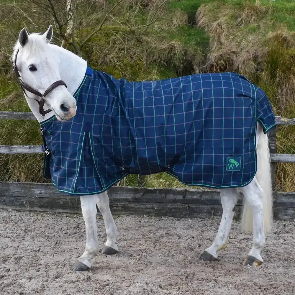 Blue and teal plaid whitaker jacob lightweight turnout rug ogm navy green with small green logo on side