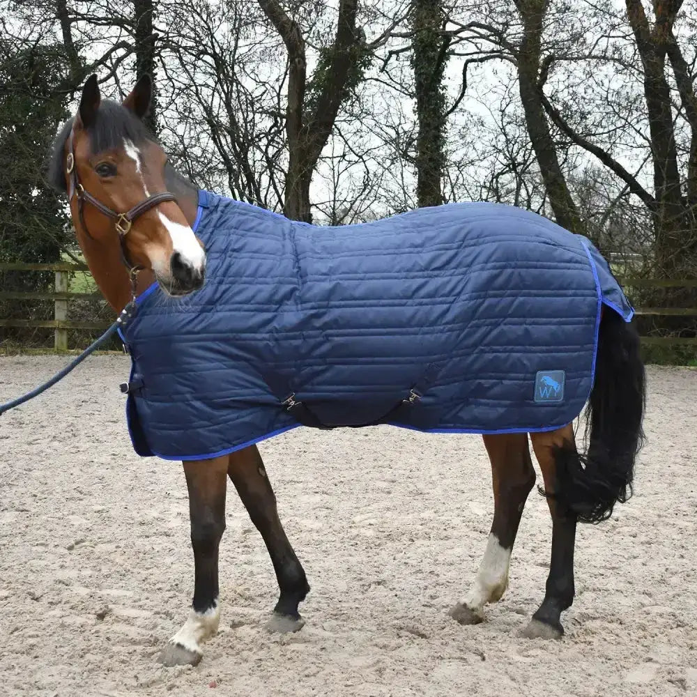 Blue quilted whitaker pippa stable rug 100gm with subtle logo patch in navy perfect for horse warmth and comfort