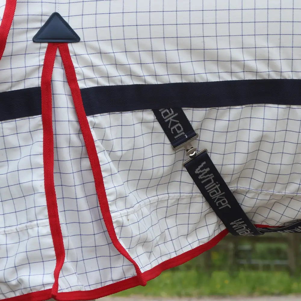 Whitaker r463 rastrick cool rug white with white grid pattern red trim and black branded straps with detachable hood