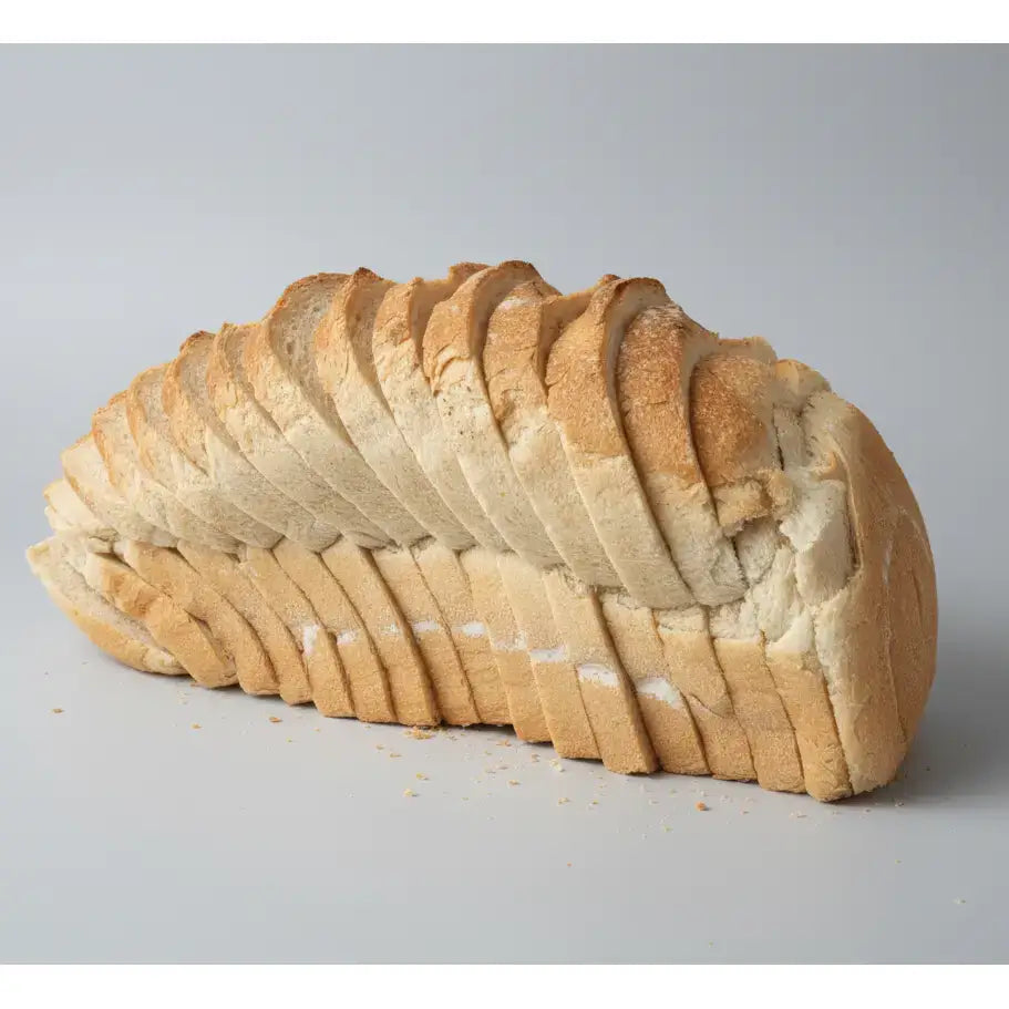 White sliced tin loaf of bread with a soft porous interior and golden brown crust perfect for sandwiches