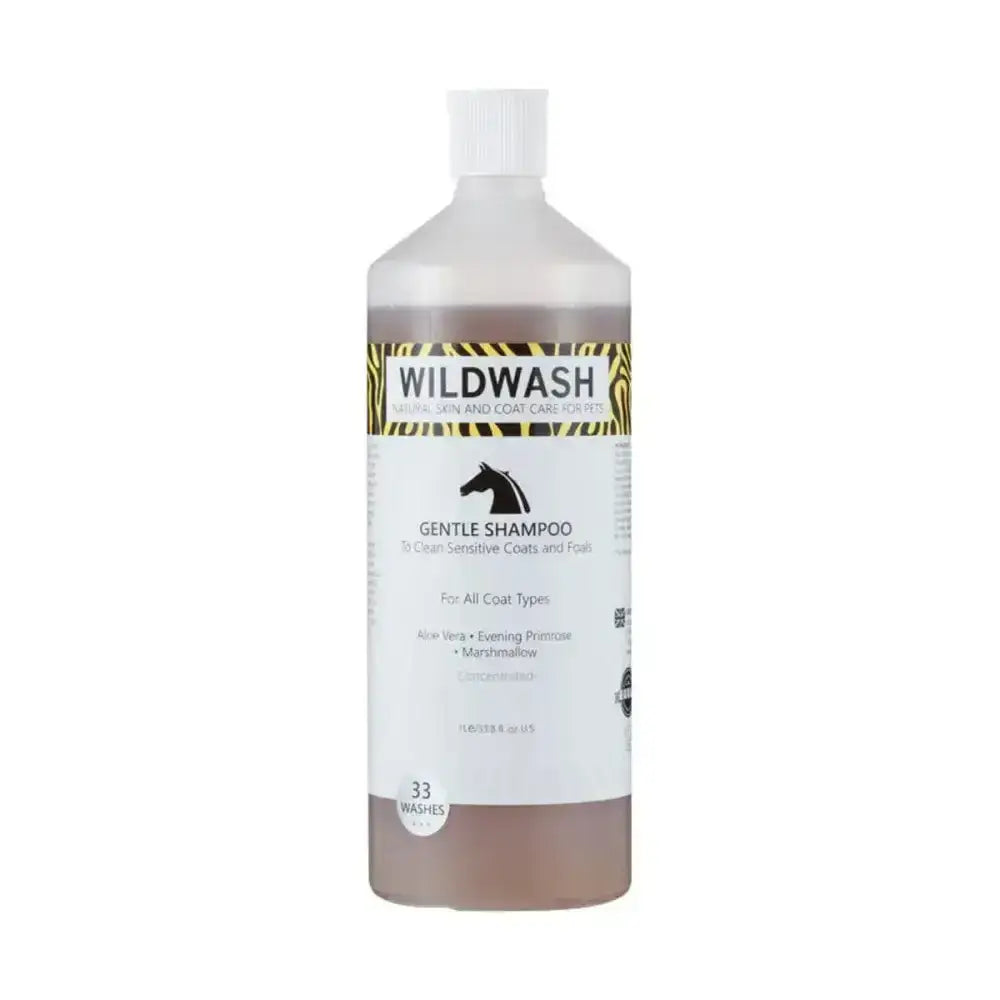 A clear plastic bottle of wildwash horse shampoo gentle with evening primrose oil and marshmallow root contains brown liquid