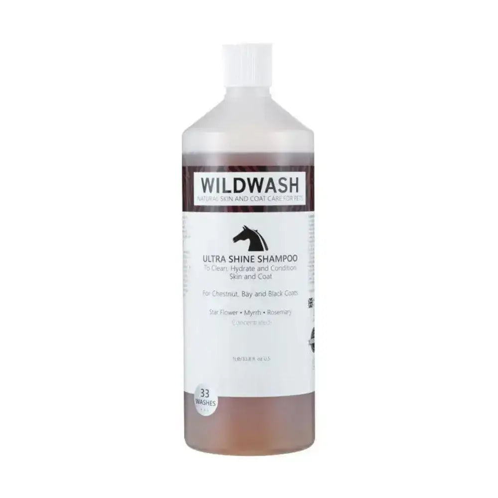 A clear plastic bottle of wildwash horse shampoo ultra shine with white cap and brown liquid for natural coat colour