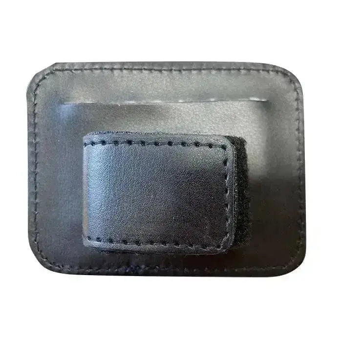 Black leather woof wear bridle number holder with stitched edges and textured surface for competition accessories