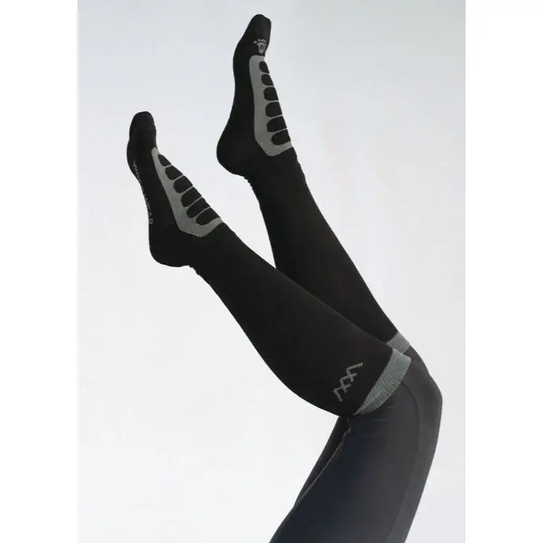 Black woof wear long bamboo tech riding sock with gray reinforced panels and subtle logo near the ankle