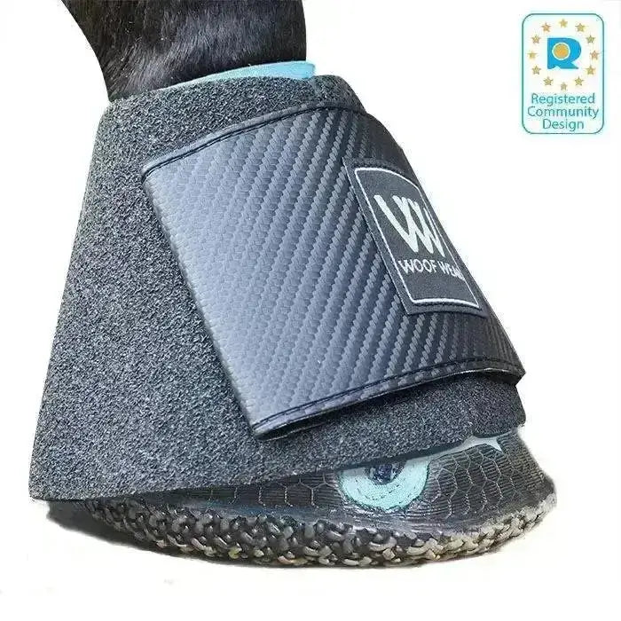Black carbon fiber-patterned woof wear medical boot with textured gray fabric and close fitting hoof boot design