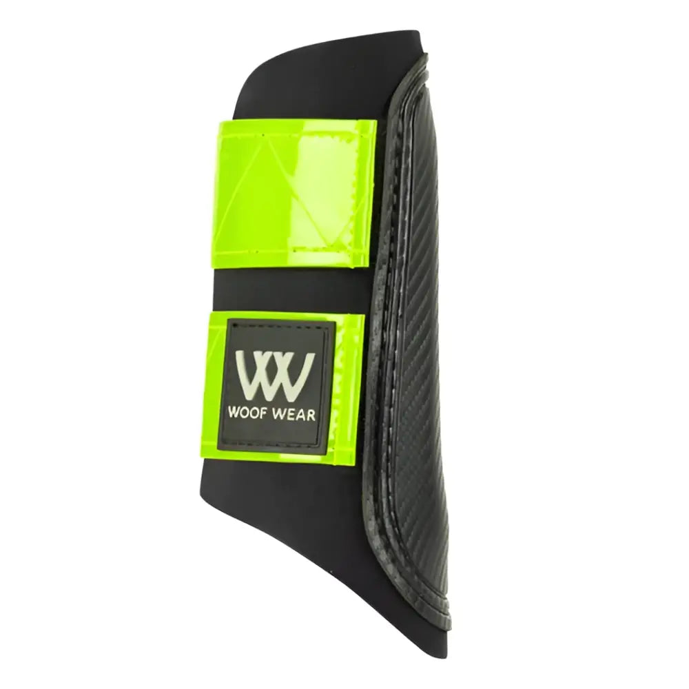 Black woof wear reflective club boot with neon green panels and logo patch for brushing boots on horses