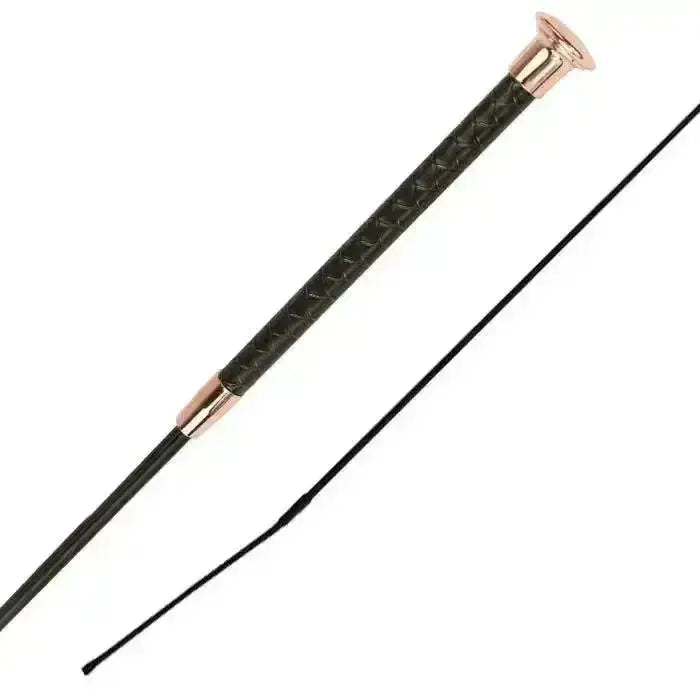 Black woof wear reptile dressage whip with patterned faux snake skin handle and rose gold accents on the grip