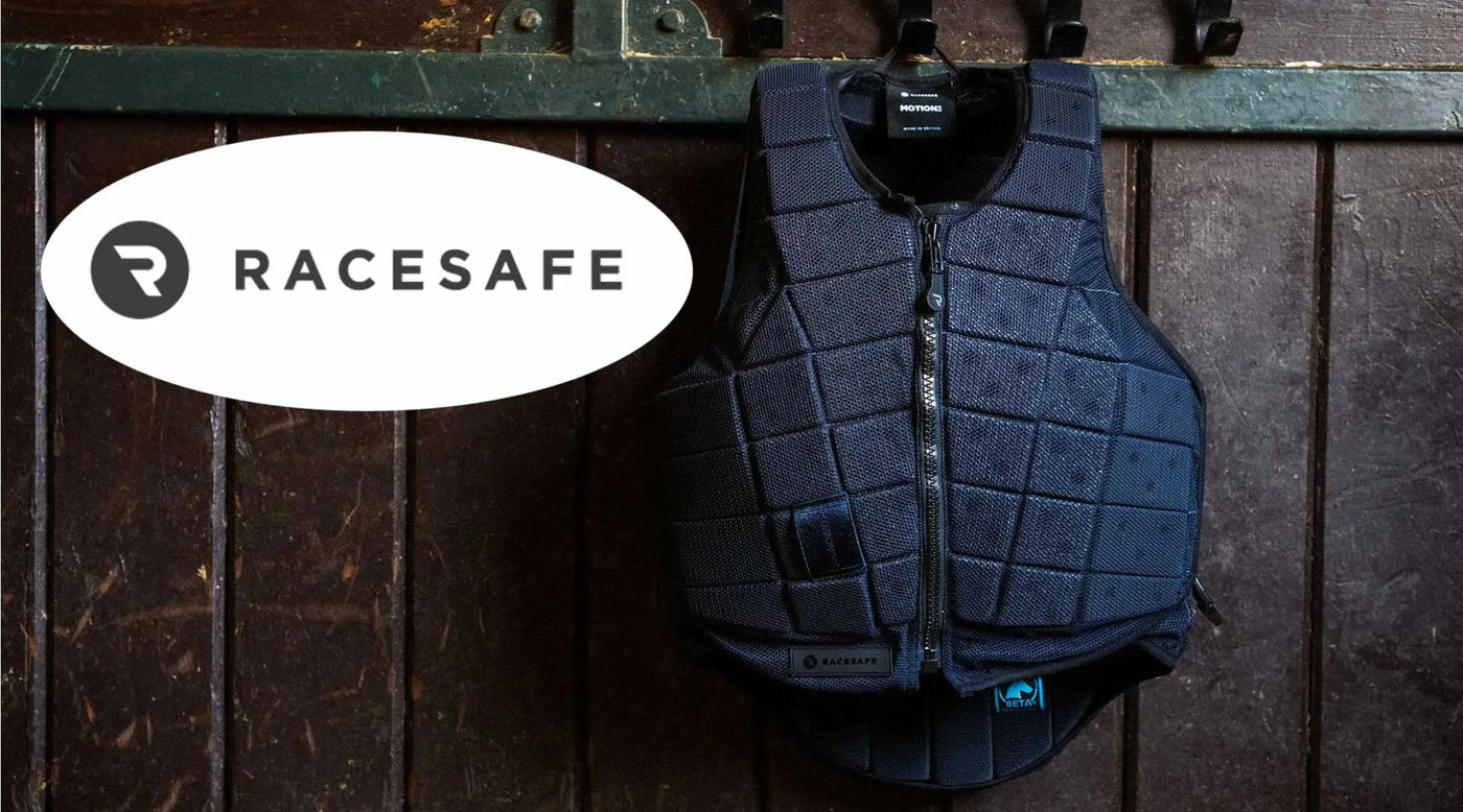 Dark blue Racesafe equestrian safety vest on a wooden surface showcasing equestrian safety equipment