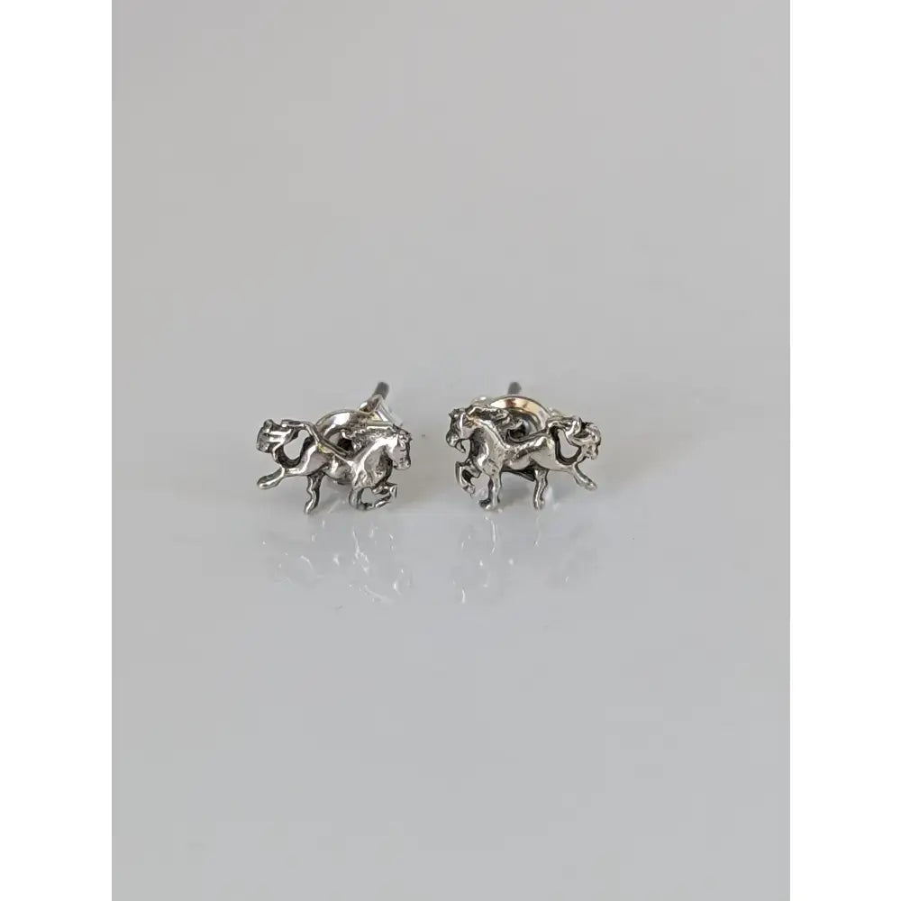 Silver galloping horse stud earrings made from 925 silver featuring handmade equestrian horse studs with dynamic galloping design