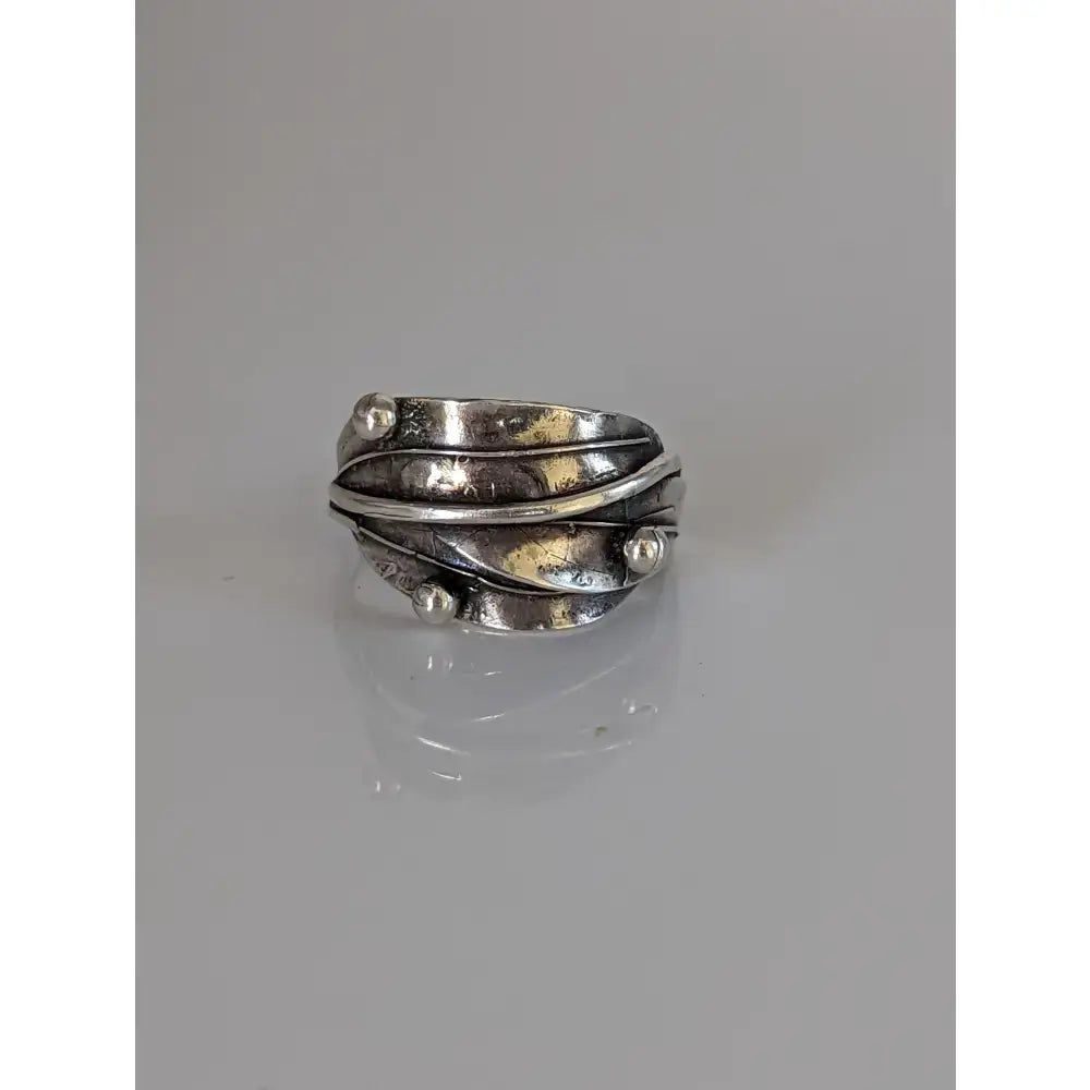 Silver leaves ring with layered twisted bands and silver buds in shiny 925 silver for a nature-inspired gift