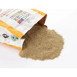 A bag of allen & page brown finely ground range layers crumble spilling on a white surface for free range layers