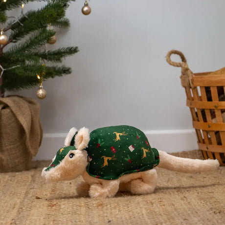 A plush ancol arnola armadillo toy with a green fabric shell decorated with yellow reindeer and red ornaments