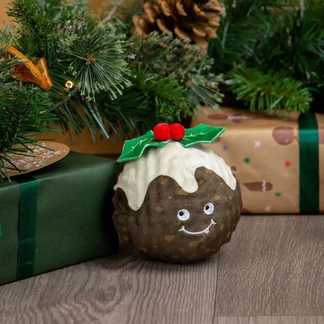 A plush brown christmas pudding toy with white icing and red holly berries from ancol bouncing colin junior