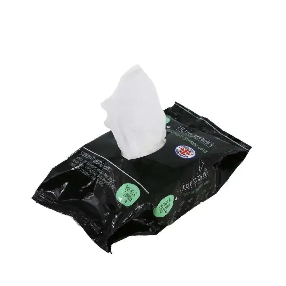 Black plastic pack of ancol little stinkers scented grooming wipes with a white pet wipe partially pulled out