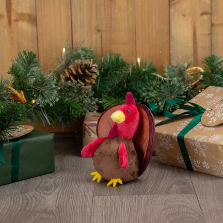 Ancol Mini Tina plush turkey toy with red head yellow beak and feet brown body and feathered tail perfect for pets