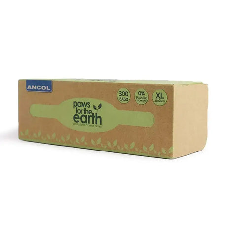 A tan cardboard box of ancol paws for the earth giant poop bag roll with 300 xl plastic free bags and green leaf design