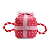 Pink polka-dotted plush gift box toy with red and white rope handles ancol pawty time pink dog toy