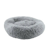 A plush gray ancol sleepy paws super plush donut bed with soft raised edges perfect for cozy pet napping