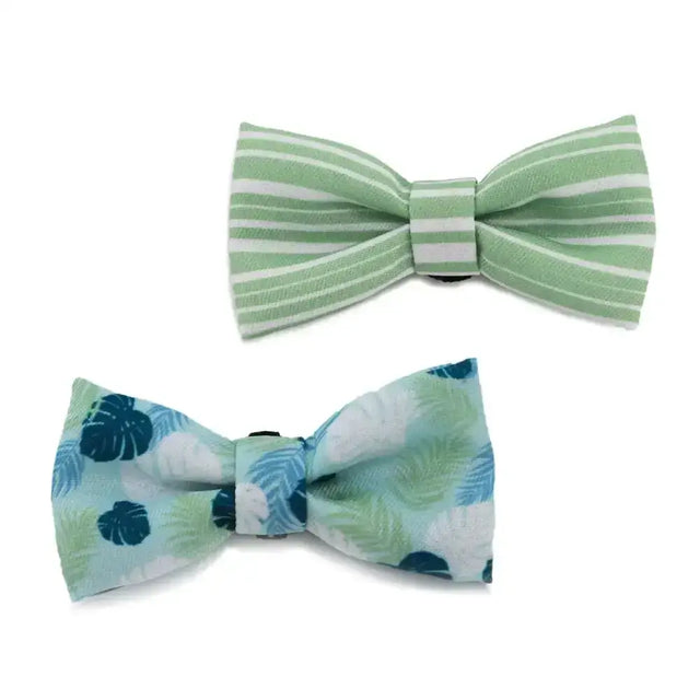 Two ancol soho pet bow ties featuring light green stripe and blue mint tropical leaf patterns for pets