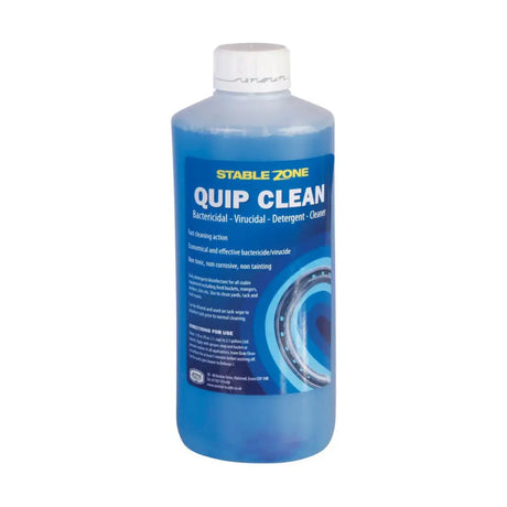 A translucent blue plastic bottle of animal health company quip clean bactericide for stable equipment including feed gear