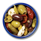 A vibrant rustic blue bowl filled with antipasti olives including stuffed green olives and green olives mix