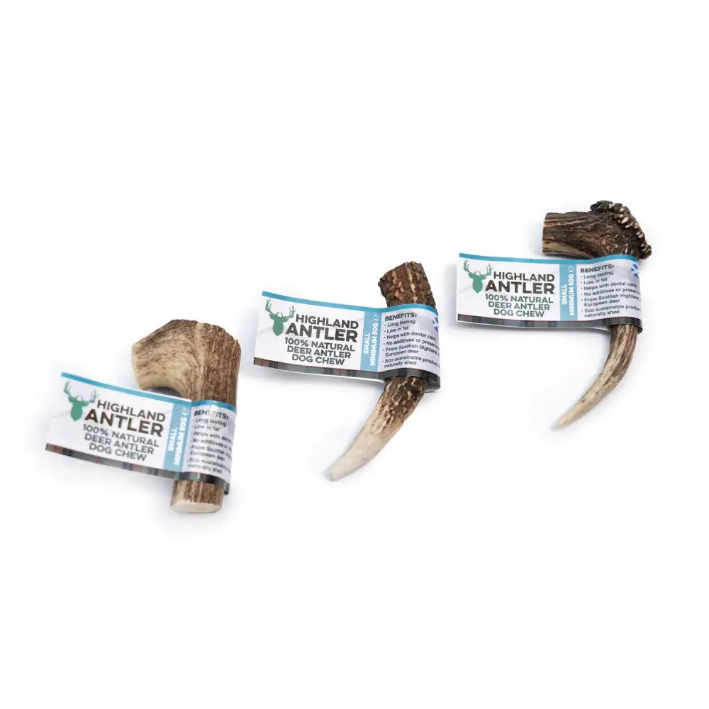 Three natural 100 percent highland antler dog chews in branded wrapping from antos highland with varied shapes and sizes