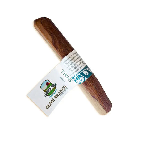 Natural brown olive wood dog chew toy with white teal paddock farm olive branch dog chew label by antos origins olive