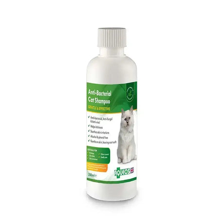 White plastic bottle of roveos aqueos anti-bacterial cat shampoo with green label for managing skin conditions