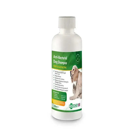 White plastic bottle of aqueos anti-bacterial dog shampoo with green label featuring a dog for water-based disinfectant use